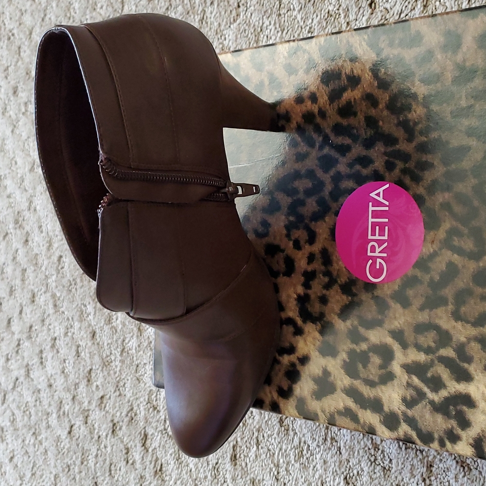 Gretta zippered shoe bootie in brown. 2 1/2 inch heel.